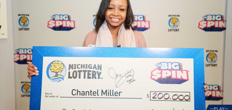 Chantel Miller holding big check after winning on The Big Spin Show